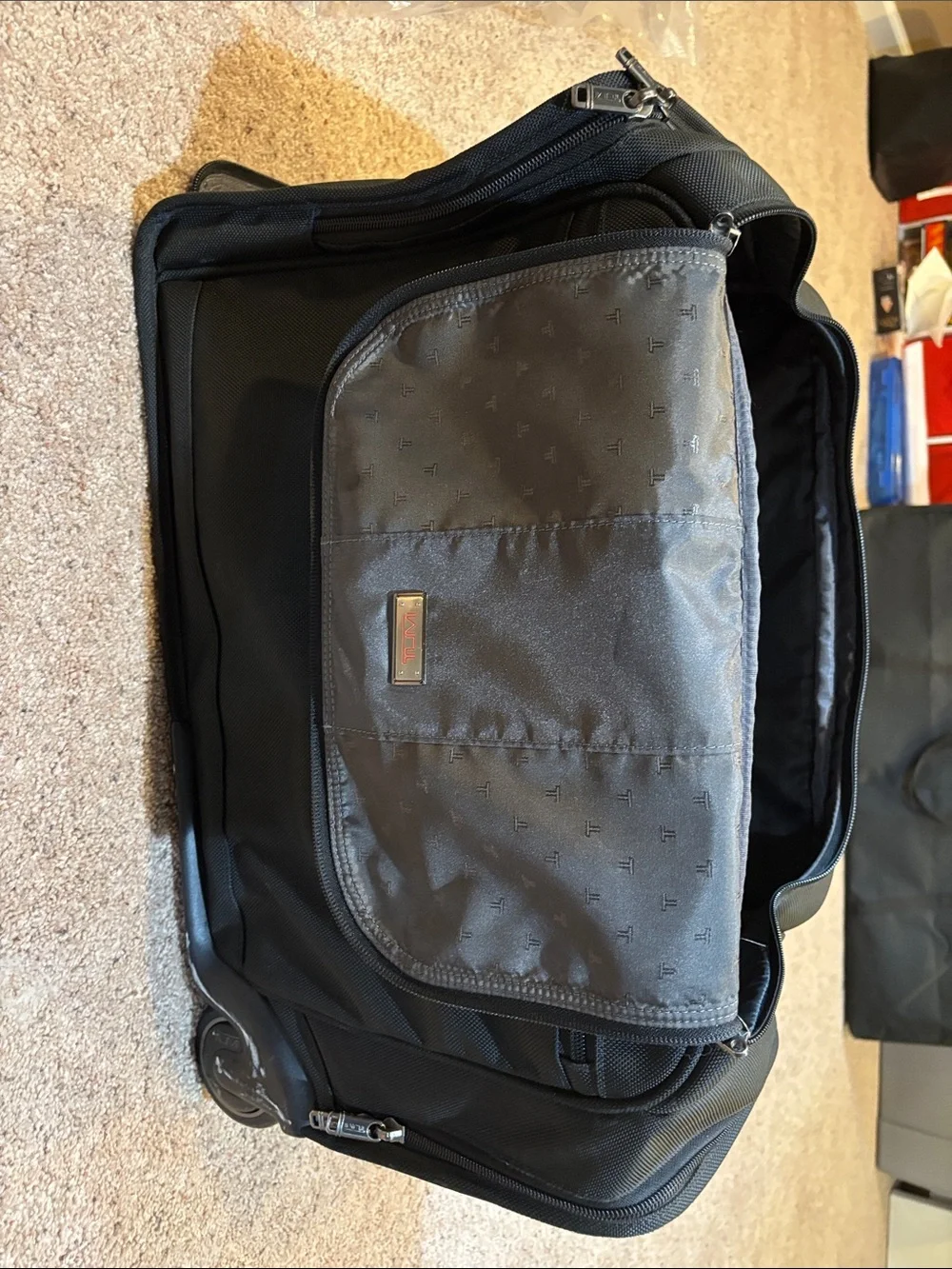 Tumi Black Rolling Carry-On Duffel with Wheels and handle